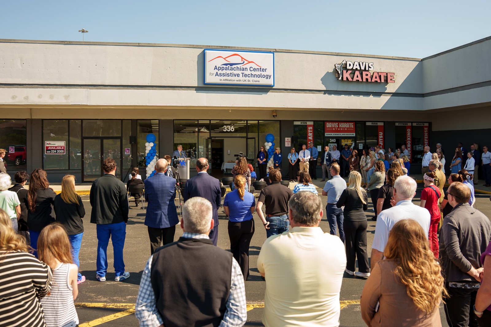 Community members gather for the ribbon-cutting ceremony of the Appalachian Center for Assistive Technology in Morehead as UK St. Claire President and CEO Donald H. Lloyd II welcomes attendees.